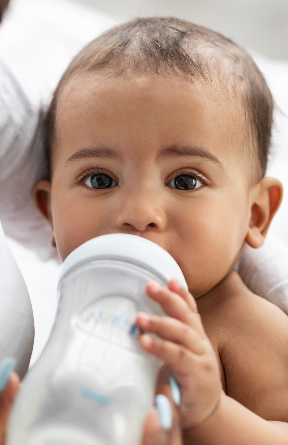 baby feeding from bottle