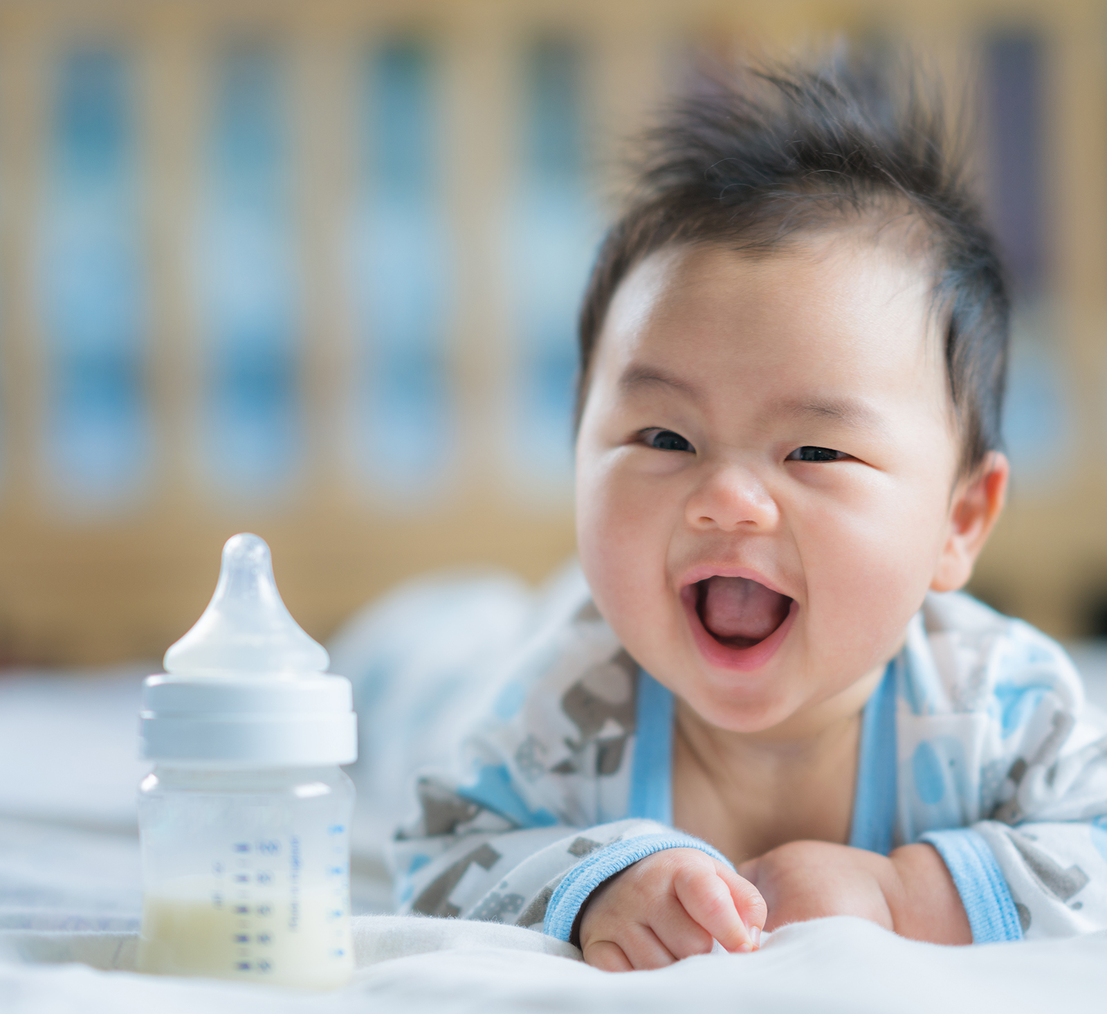 happy baby with bottle